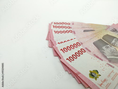 Close up One Hundred thousand Indonesian banknotes (Rupiah). Cash payment concept. Indonesian rupiah currency (Rp. 100,000 One Hundred Thousand Rupiah) on a white background
