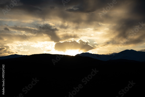 Sun setting Behind the Colorado Rocky Mountains