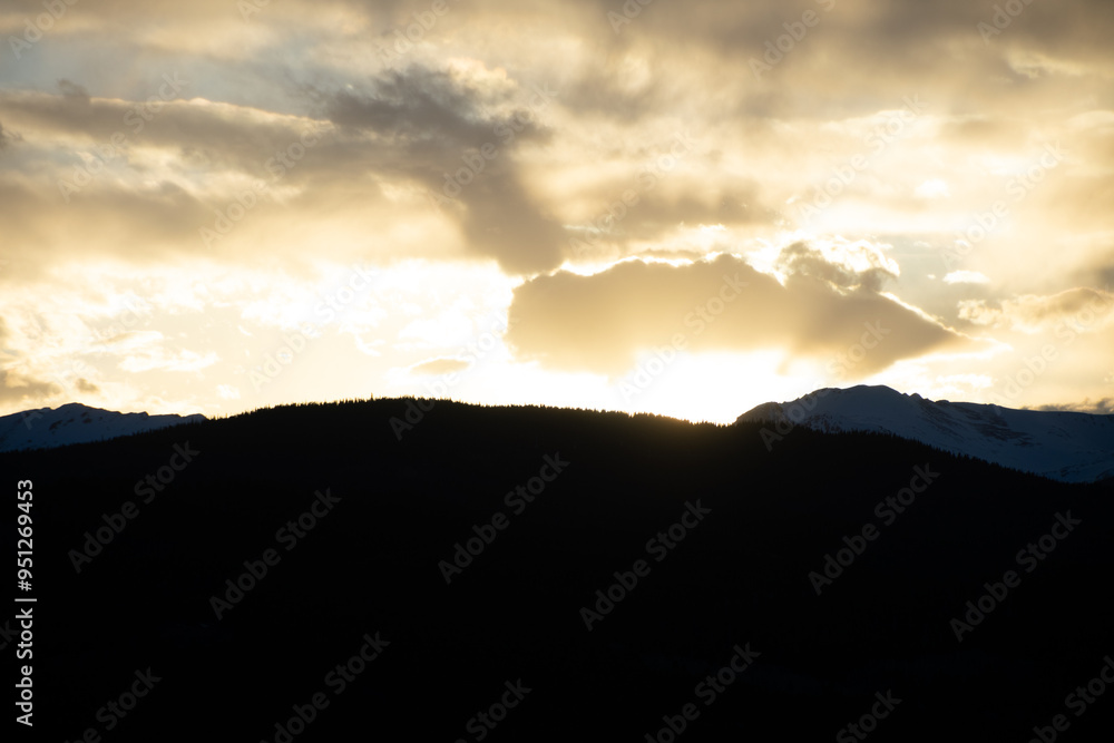 Sun setting Behind the Colorado Rocky Mountains Sun setting Behind the Colorado Rocky Mountains