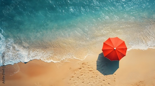 Aerial View of Vibrant Red Umbrella on Idyllic Summer Beach with Vast Ocean Backdrop