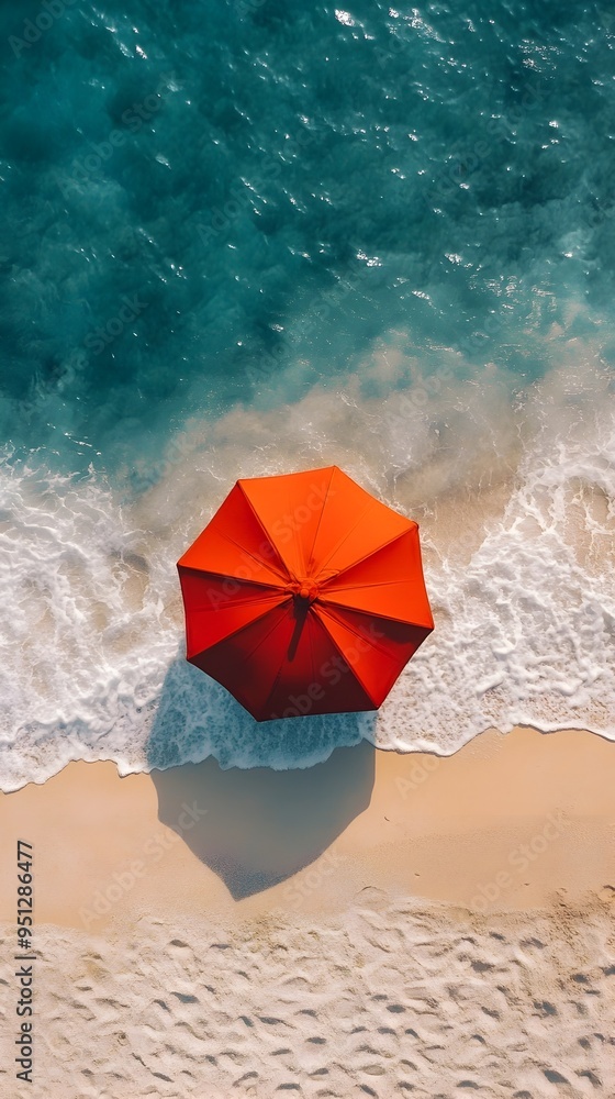 Naklejka premium Overhead Aerial View of Vibrant Red Umbrella on Pristine Summer Beach