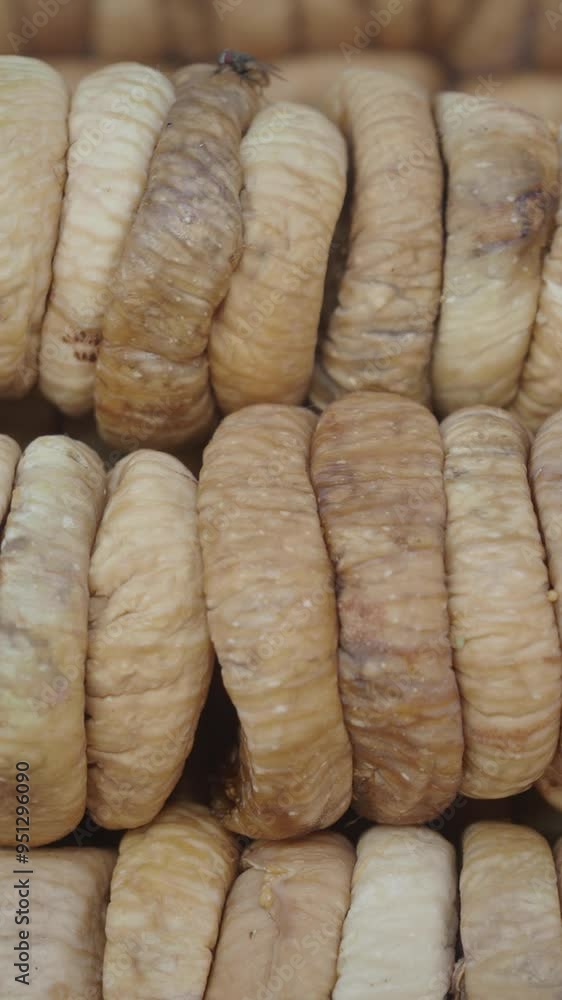 A CloseUp View of Natural Dried Fig Rolls Stacked Neatly Together, Showcasing Their Texture A CloseUp View of Natural Dried Fig Rolls Stacked Neatly Together, Showcasing Their Texture