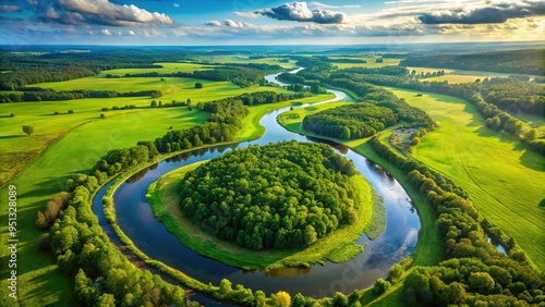 Aerial view of a meandering river flows northward through a lush green landscape, serpentine and scenic. photo