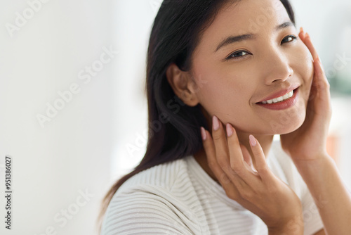 Face Skin Care. A Woman With Radiant Skin Smiling Gently, Emanating Feelings Of Confidence And Tranquility. Skincare And Natural Beauty Are Highlighted In This Serene, Close-Up Portrait.