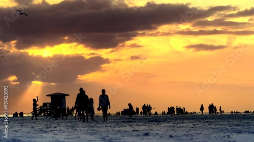 People on tropical beach during sunset in SiestaKey, Sarasota, Florida photo