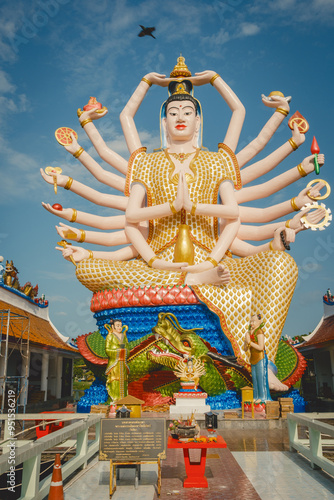 Wat Plai Laem Temple buddhist in Koh Samui Island Thailand tilt up of big buddha sculpture landmark