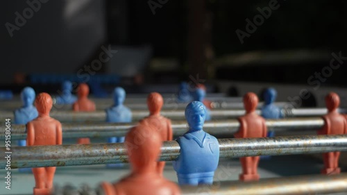 blue figure on soccer table turning around