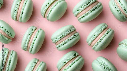 Mint macaroons in a row on pink background,french macaroons,Paris Pastry macaron green tea,Pastry shop card with copy space,french macaroons,bakery and branding concept,copy space.