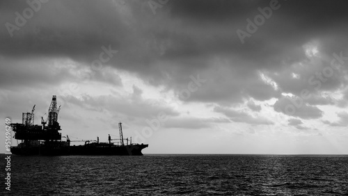 Drilling rig and FPSO ship black and white silhouette, Offshore oil field, oil and gas industry