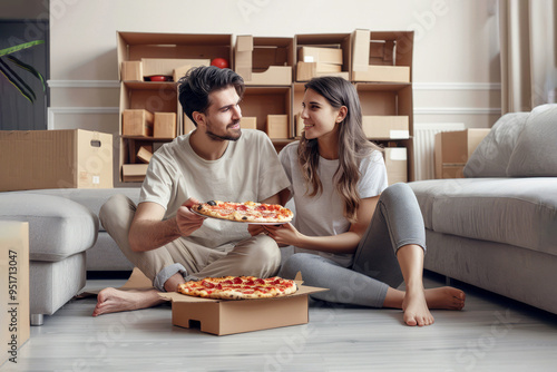 The moving in a new home. A young couple sitting on the floor of photo