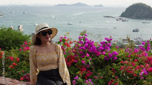 Beautiful young Asian woman enjoying holiday trip in Puncak Waringin, Labuan Bajo. photo