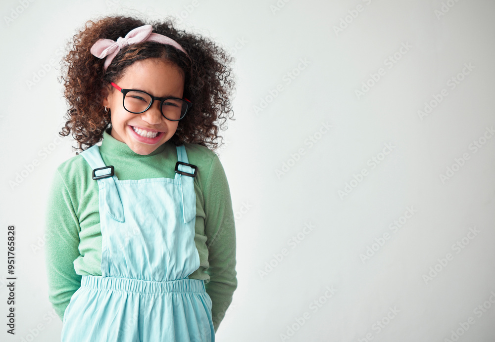 Happy, glasses and portrait of child in studio with mockup space for prize, deal or giveaway. Shy, smile and cute girl kid from Mexico with promotion, winner or vision isolated by white background. Happy, glasses and portrait of child in studio with mockup space for prize, deal or giveaway. Shy, smile and cute girl kid from Mexico with promotion, winner or vision isolated by white background.