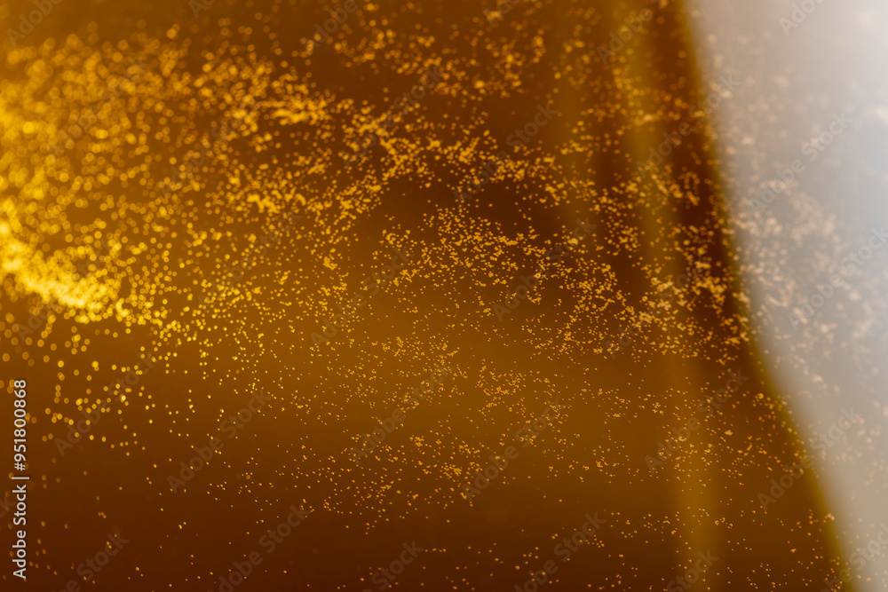 yellow apple juice in a clear glass with bubbles yellow apple juice in a clear glass with bubbles