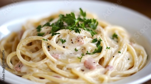 Creamy Carbonara Pasta Dish Garnished with Fresh Parsley. A Rich and Savory Italian Classic Featuring Smooth Sauce and Tender Pasta,