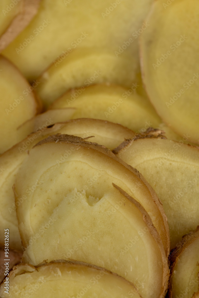 details of the ginger root used in cooking sliced into pieces details of the ginger root used in cooking sliced into pieces