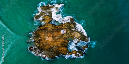 sea waves breaking on the rocks background 