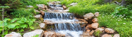 Flowing waterfall in wilderness with rugged terrain and rocky landscape, waterfall, raw nature