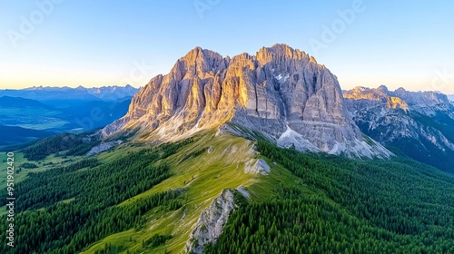 Sunrise over Alpine forest peaks, golden light illuminates rugged mountains and forest canopy, breathtaking dawn scene