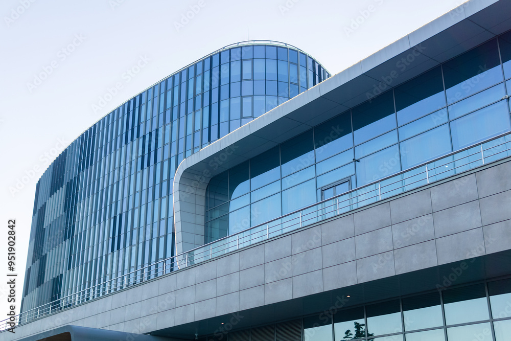 Obraz premium modern architecture, glass facade element of contemporary building against evening sky