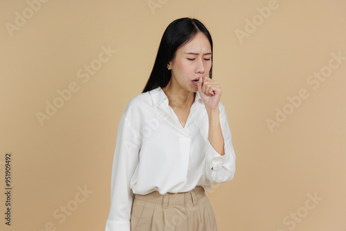 Woman Coughing with Hand on Chest, Suffering from Chest Pain, Beige Background