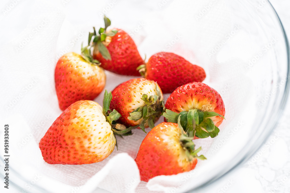 Washed and Dried Strawberries Neatly Stored in a Glass Bowl Washed and Dried Strawberries Neatly Stored in a Glass Bowl