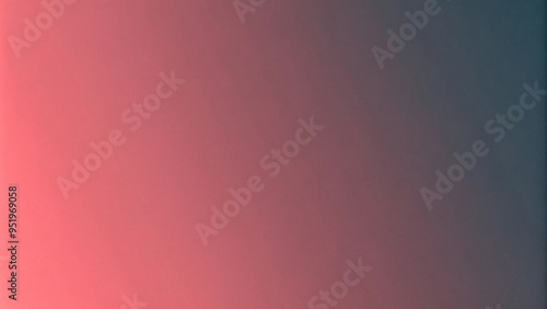 A soft gradient blends from dark gray on the left side of the image to a warm coral-pink on the right side. photo