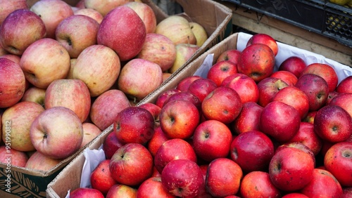 Fresh Red and Yellow Apples at a Market Stall