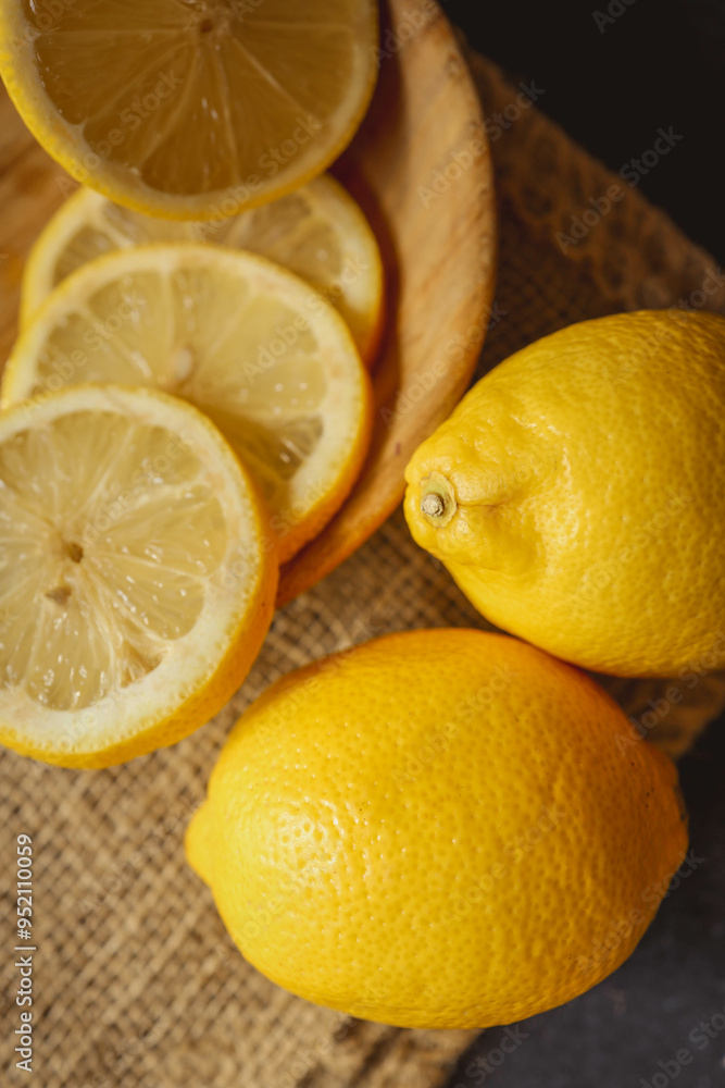 Fresh and juicy lemon on a dark rustic background Fresh and juicy lemon on a dark rustic background