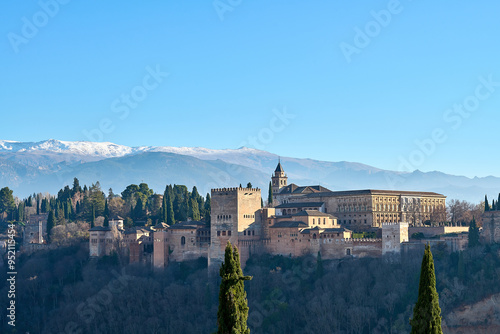 Alhambra castle in Granada in front of Sierra Nevada mountains
