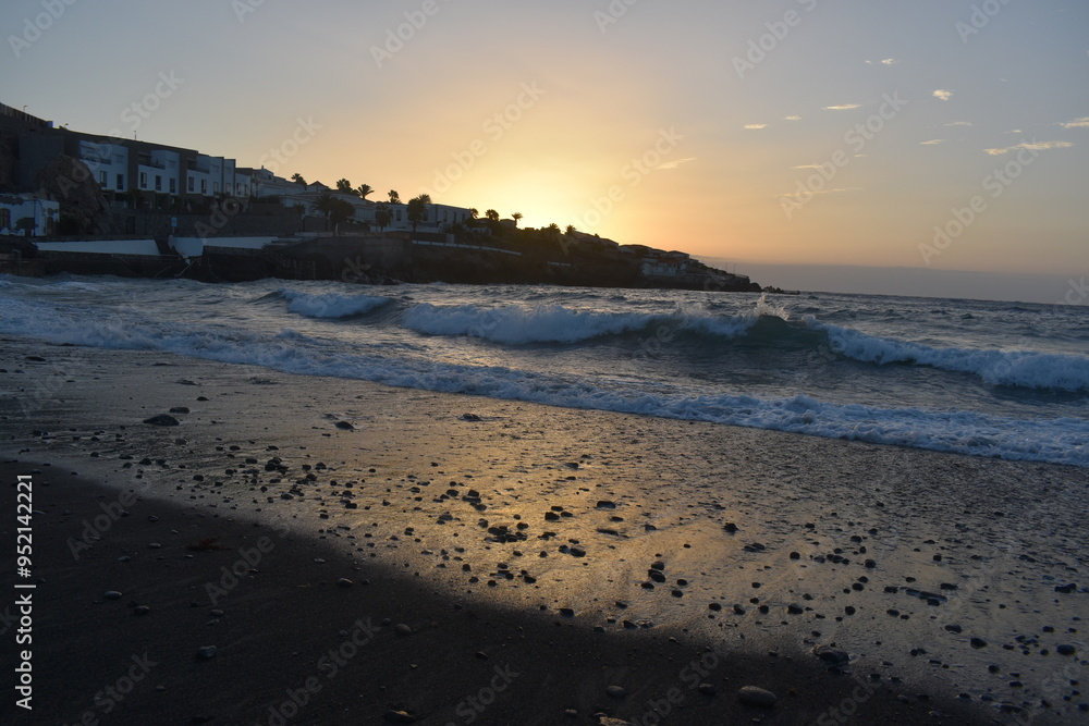A beautiful sunrise in Tenerife with the sea A beautiful sunrise in Tenerife with the sea