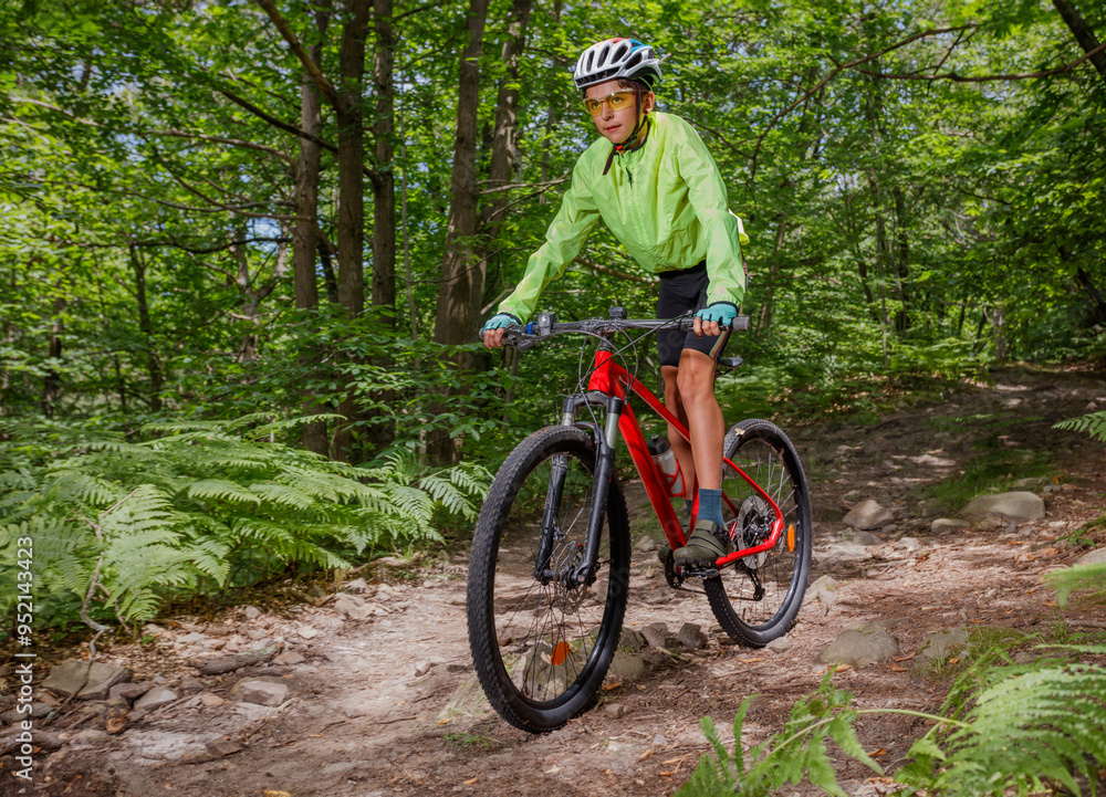 Biking adventure in a dense, beautiful forest on rugged trail Biking adventure in a dense, beautiful forest on rugged trail
