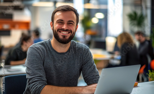 man working on laptop in cafe