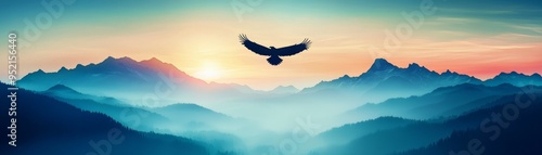 A majestic eagle soaring over misty mountains at sunrise, capturing the essence of freedom and natural beauty. photo