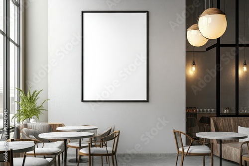 A modern caf? interior featuring empty tables and a blank framed artwork.
