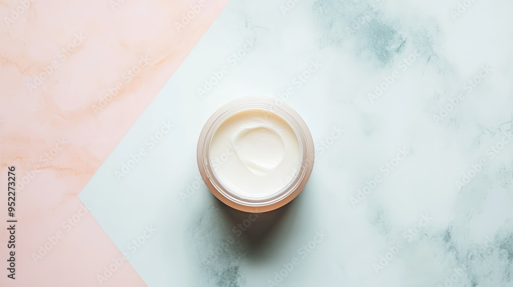 Top view of an elegant cream jar with a spread of product next to it on a smooth pastel surface, Top view of an elegant cream jar with a spread of product next to it on a smooth pastel surface,