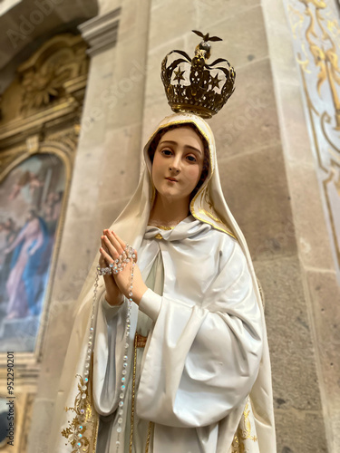 Photography Image of Our Lady of Fátima with Crown and hands folded in prayer in the Basilica of Santuario do Sameiro in Bom Jesus do Monte, Braga, Portugal