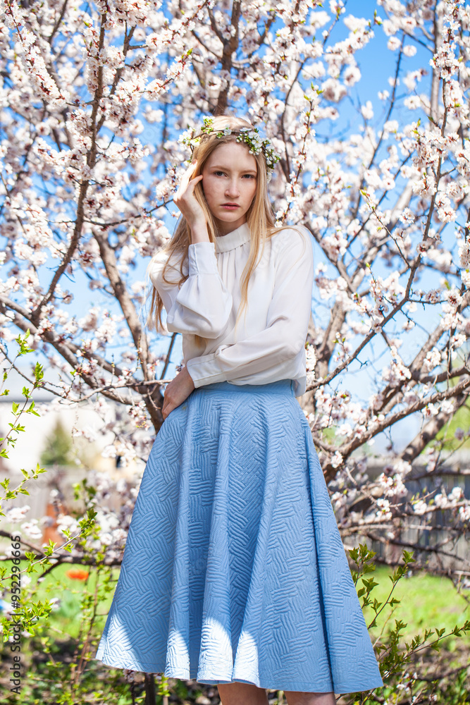 Young beautiful woman in a blooming garden Young beautiful woman in a blooming garden