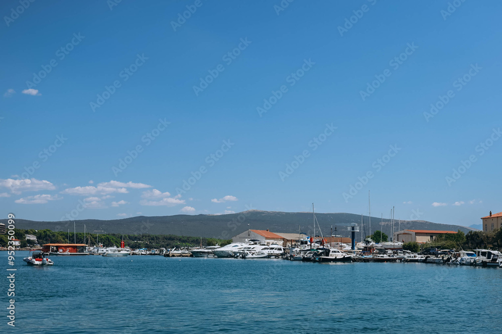 Island Krk, Croatia - August 1, 2024: boasts stunning seascapes adorned with luxurious yachts, offering a perfect blend of natural beauty and maritime charm, northern Adriatic Sea, located near Rijeka Island Krk, Croatia - August 1, 2024: boasts stunning seascapes adorned with luxurious yachts, offering a perfect blend of natural beauty and maritime charm, northern Adriatic Sea, located near Rijeka