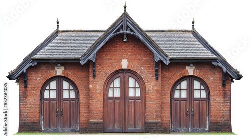 A symmetrical brick building with three arched doors and a gabled roof.