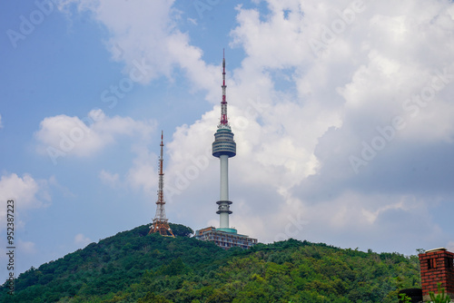 Namsan Tower, a landmark in Seoul, South Korea, with the surrounding cityscape in the background. photo