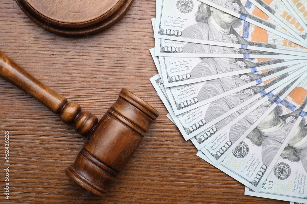 Alimony. Money, judge's gavel and sound block on wooden table, flat lay Alimony. Money, judge's gavel and sound block on wooden table, flat lay