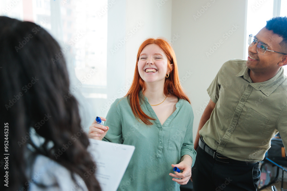 Contemporary co-working space with young professionals or students collaborating on projects, demonstrating teamwork. Contemporary co-working space with young professionals or students collaborating on projects, demonstrating teamwork.