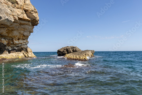 Obraz na płótnie View from the water of picturesque coastline with cliffs and caves by Adriatic Sea, Polignano a Mare, Italy, Apulia w salonie