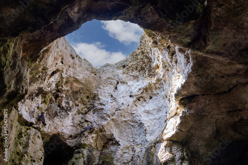 Obraz na płótnie View of the sky from inside the grotto through an opening in the cliff, Polignano a Mare, Italy, Apulia w salonie