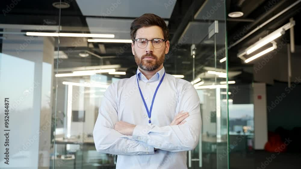 Portrait of IT engineer admin standing confidently in office with arms crossed. Serious developer technician posing looking camera. Demonstrating leadership, professionalism, expertise in technology Portrait of IT engineer admin standing confidently in office with arms crossed. Serious developer technician posing looking camera. Demonstrating leadership, professionalism, expertise in technology