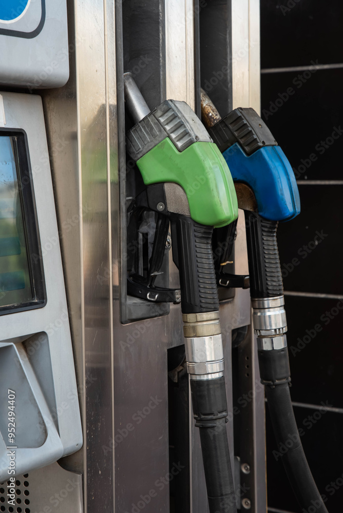 Gas station scene with Gasoline, petrol or diesel pump nozzle. Concept of gasoline prices and fuel costs. Oil petrol station. Gas station scene with Gasoline, petrol or diesel pump nozzle. Concept of gasoline prices and fuel costs. Oil petrol station.