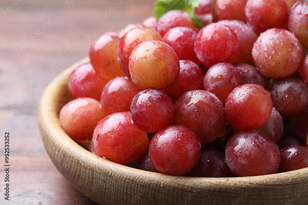 Fresh ripe grapes on wooden table, closeup Fresh ripe grapes on wooden table, closeup