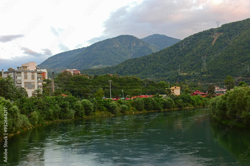 Natural river water flowing through greenery Natural river water flowing through greenery