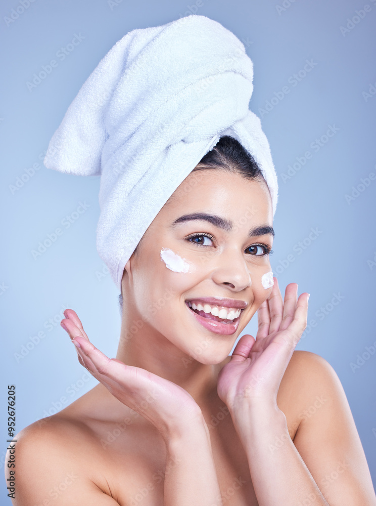Portrait, woman and cosmetics with beauty, cream and dermatology on blue studio background. Happy person, face and model with towel, grooming routine and creme with treatment, wellness and soft skin Portrait, woman and cosmetics with beauty, cream and dermatology on blue studio background. Happy person, face and model with towel, grooming routine and creme with treatment, wellness and soft skin