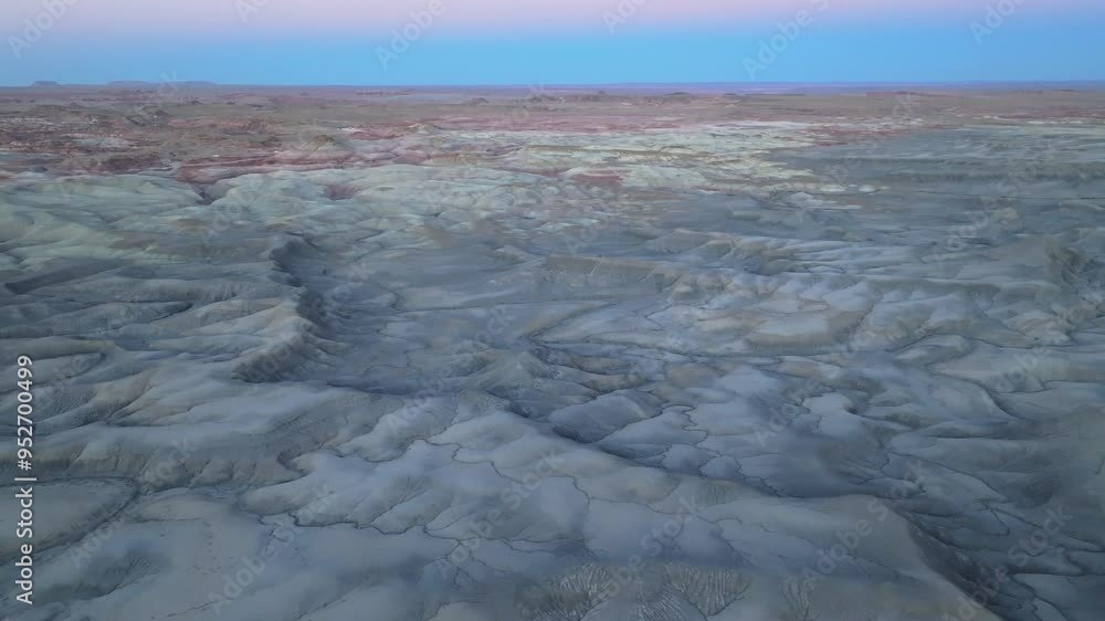Aerial sunrise video of otherworldly desert featuring abstract geological rock formations in 4K Aerial sunrise video of otherworldly desert featuring abstract geological rock formations in 4K